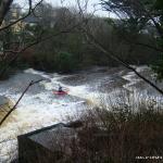 Photo of the Ennistymon Falls in County Clare Ireland. Pictures of Irish whitewater kayaking and canoeing. Jonathan Ryan at Ennistymon Falls. Photo by Tony Walsh