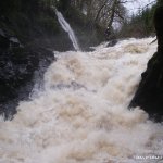 Photo of the Glenarm river in County Antrim Ireland. Pictures of Irish whitewater kayaking and canoeing. Johnny running the middle drop on the Glenarm Grade 5 , in medium to high water, In my opinion any higher than this it is unrunable due to a horizontal stopper throwing you into  the far wall where rescue is impossible, That photo was taken by roger norrris in december 2007. Photo by Roger Norrris 2007