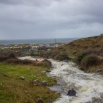 Photo of the Caher river in County Clare Ireland. Pictures of Irish whitewater kayaking and canoeing. David Higgins & Ciaran McElhinney in the distance after the main slide. Photo by Barry Loughnane