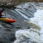 Photo of the Kings River in County Kilkenny Ireland. Pictures of Irish whitewater kayaking and canoeing. Big weir high water river right line. Photo by Adrian