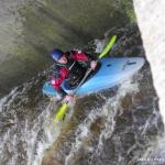 Photo of the Lower Corrib river in County Galway Ireland. Pictures of Irish whitewater kayaking and canoeing. Waiting to surf eddy river-right of O'Brien's wave. Photo by Sorcha Schnittger