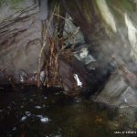 Photo of the Coomeelan Stream in County Kerry Ireland. Pictures of Irish whitewater kayaking and canoeing. Entrance to 20m long syphon under boulder. Photo by Daith