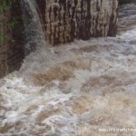  Bunhowna River - Under the bridge.The small undercut that we use as a gauge is barely visible river left.If there's a cushion wave forming off the bridge pillar your in for a good time 