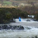 Photo of the Gearhameen river in County Kerry Ireland. Pictures of Irish whitewater kayaking and canoeing. grade 4 section puts paul in air in a GTX. Photo by kayakerpaul