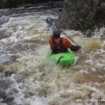 Photo of the Mayo Clydagh river in County Mayo Ireland. Pictures of Irish whitewater kayaking and canoeing. Aidan running through the upper section quasi gorge yoke. Photo by Graham Clarke
