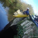 Photo of the Barrow river in County Carlow Ireland. Pictures of Irish whitewater kayaking and canoeing. tony seal launching into the pool beside th e car park at clashganny. Photo by michael flynn