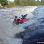 Photo of the Barrow river in County Carlow Ireland. Pictures of Irish whitewater kayaking and canoeing. john power & brian somers playing on the second wier at clashganny in high water. Photo by michael flynn