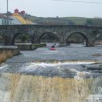 Photo of the Ennistymon Falls in County Clare Ireland. Pictures of Irish whitewater kayaking and canoeing. Jonathan Ryan at Ennistymon Falls. Photo by Tony Walsh