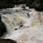 Photo of the Dargle river in County Wicklow Ireland. Pictures of Irish whitewater kayaking and canoeing. Cillian going deep. Photo by DM