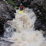 Photo of the Upper Owenglin river in County Galway Ireland. Pictures of Irish whitewater kayaking and canoeing. Darragh at the top of Trojan Falls on a low level. . Photo by Ross Lynch