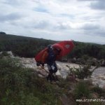 Photo of the Bunhowna river in County Mayo Ireland. Pictures of Irish whitewater kayaking and canoeing. Aidan getting out at the take out. Photo by Graham Clarke
