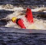 Photo of the Lower Corrib river in County Galway Ireland. Pictures of Irish whitewater kayaking and canoeing. Bowsie goin for an air lop in the top hole on the rapids.