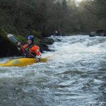 Photo of the Aughrim river in County Wicklow Ireland. Pictures of Irish whitewater kayaking and canoeing. Alison beirne finishes the first mini gorge. Photo by steve fahy