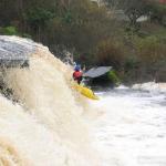 Photo of the Ennistymon Falls in County Clare Ireland. Pictures of Irish whitewater kayaking and canoeing. Eoin O'R main drop. Photo by Tiernan