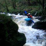 Photo of the Glensheelan river in County Waterford Ireland. Pictures of Irish whitewater kayaking and canoeing. zoom in of tony coming off the small slab drop. Photo by Michael Flynn
